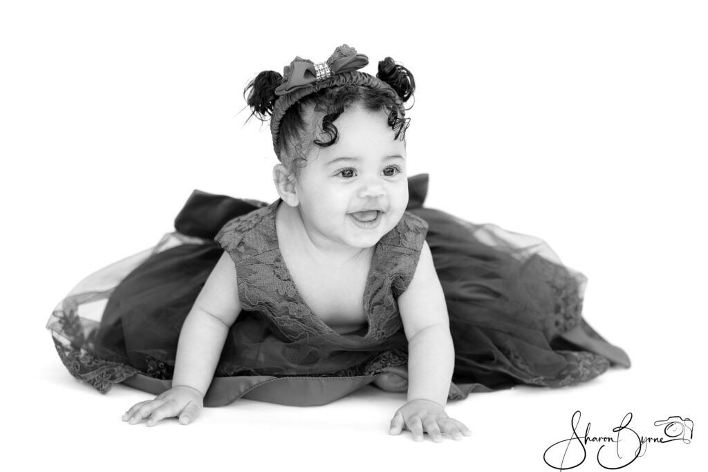 Profile of a 10-month-old baby during a toddler photoshoot.