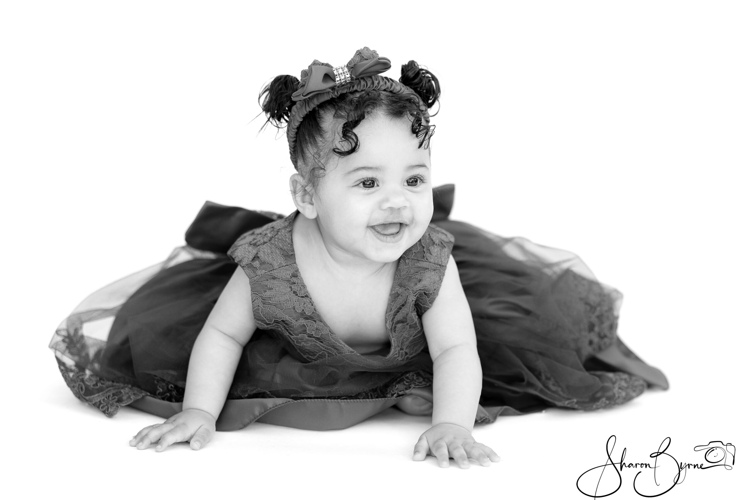 Profile of a 10-month-old baby during a toddler photoshoot.