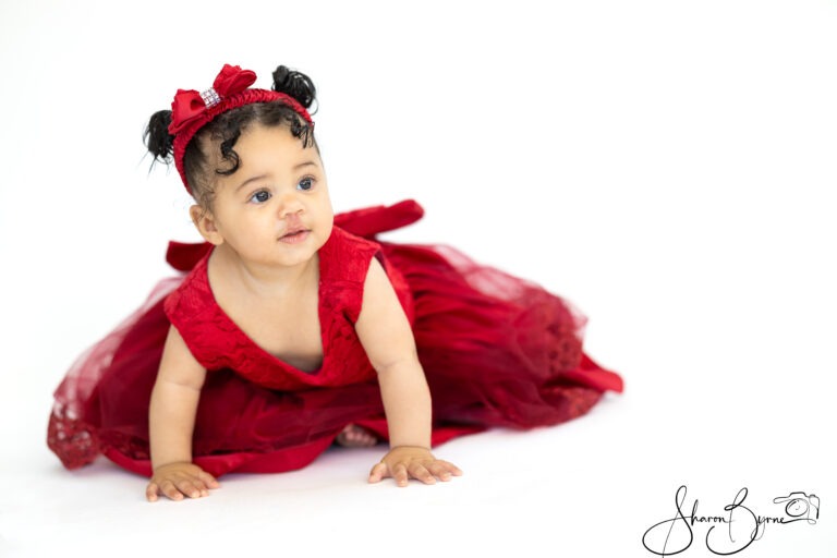 Profile of a 10-month-old baby during a toddler photoshoot.